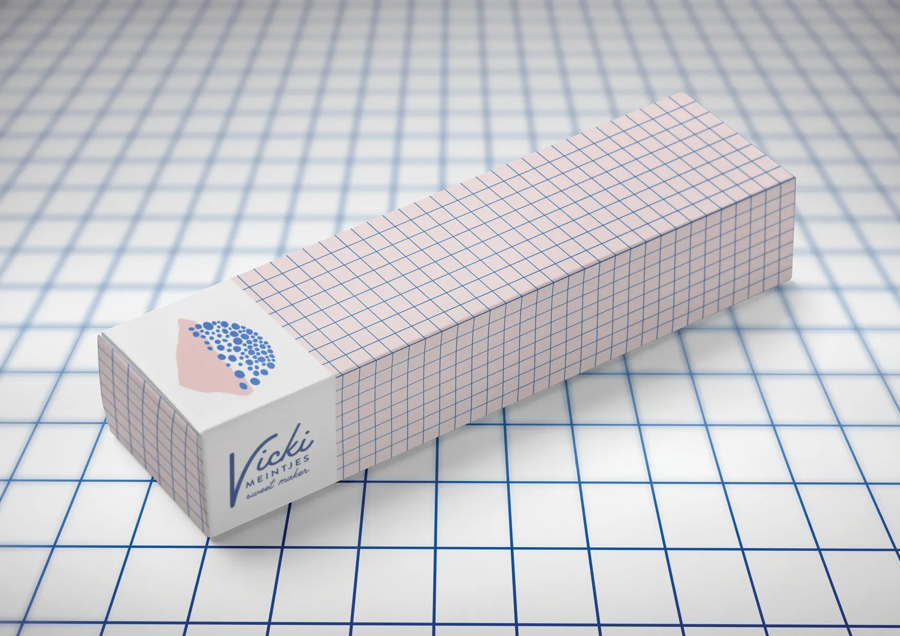 A packaging concept exploring a grid pattern in pink, paired with the dotted brand mark, for a longer box format